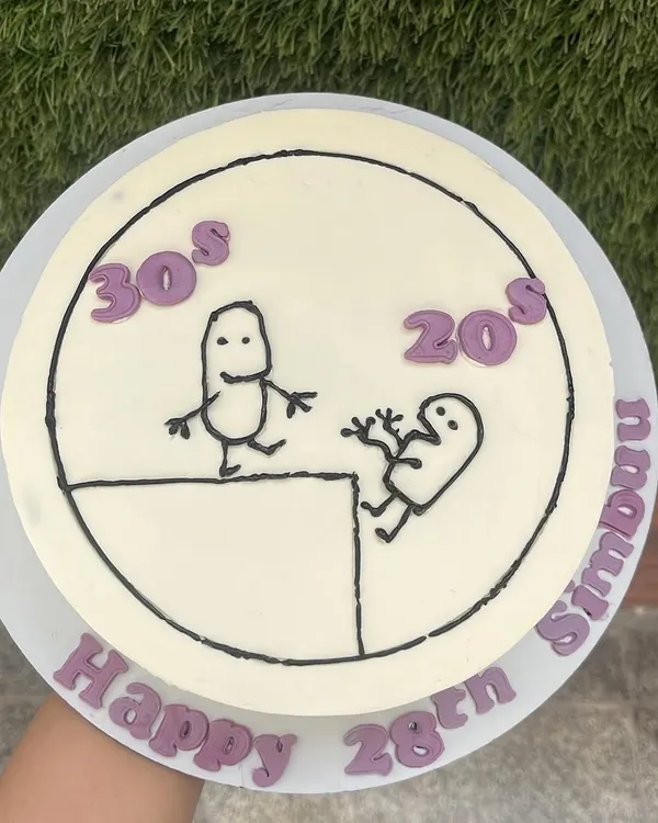 A playful take on turning 28. This doodle cake, with our delicious Chocolate & Salted Caramel Praline flavor, captures the fun of milestone birthdays with a simple, hand-drawn design.