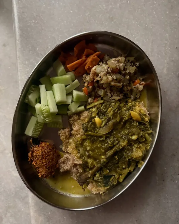 A typical `oota` plate from my kitchen, featuring quinoa, soppina huli, and various vegetable preparations. This shows how a traditional meal can be packed with diverse nutrients.