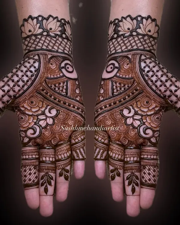 A classic, symmetrical full-hand design. I focus on clean lines and a balance of bold and delicate patterns to make the design pop.