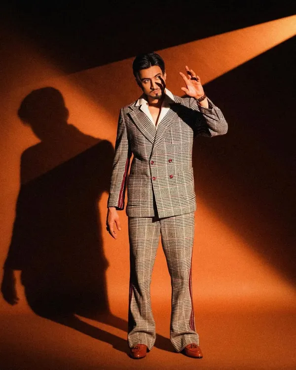 A behind-the-scenes shot from a shoot with creator Mr. Faisu. I styled him in a retro-inspired plaid suit with flared trousers, creating a cool, 70s vibe with a modern edge.