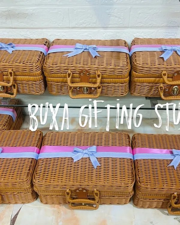 A heartfelt thank you for your bridesmaids. I designed these elegant wicker-style trunks with soft lilac and blush ribbons to hold special gifts for the bride's forever girls.