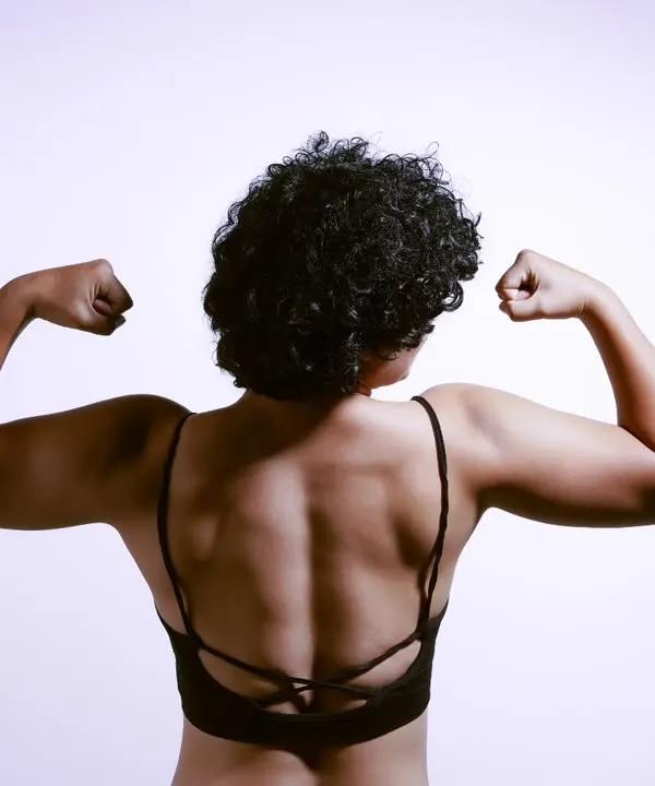 A powerful fitness portrait showcasing a model's back muscles. This shot highlights my ability to capture strength and definition for fitness influencers and brands.