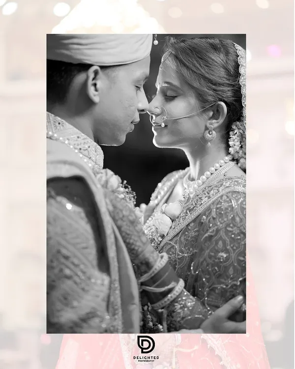 This black and white portrait captures the quiet intimacy between a couple on their wedding day, a timeless moment of connection just before the celebrations begin.