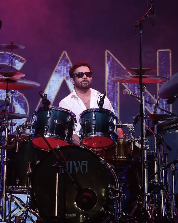 The drummer from Sanam Band performing on a stage we designed and managed, complete with professional lighting and sound.