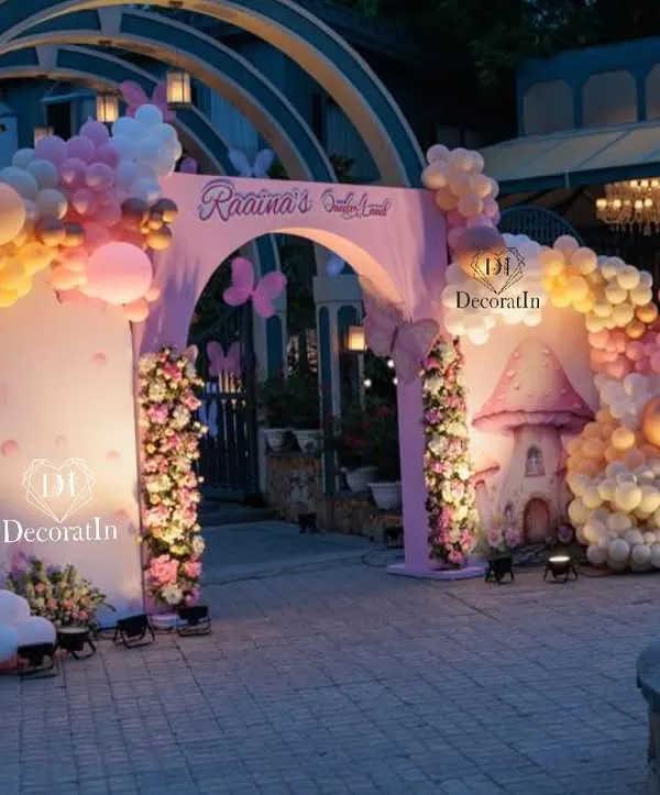We believe in making grand entrances. This whimsical butterfly-themed arch welcomed guests to a fairytale first birthday, setting a magical tone from the very first step with custom structures, lush balloon garlands, and enchanting lighting.
