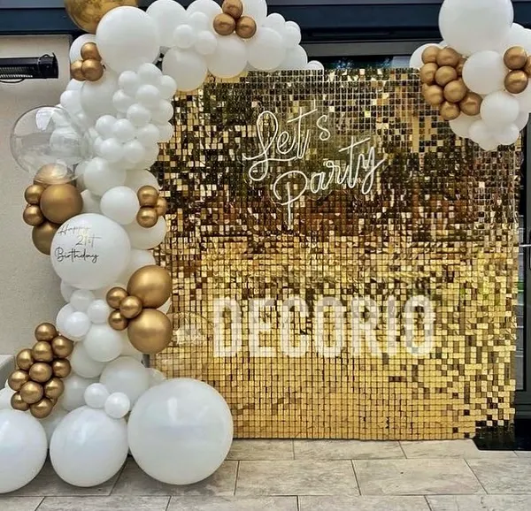 This stunning gold sequin wall with a custom neon sign is perfect for creating a glamorous photo corner. It's a popular choice for birthdays, anniversaries, and any event where you want to add a touch of sparkle.