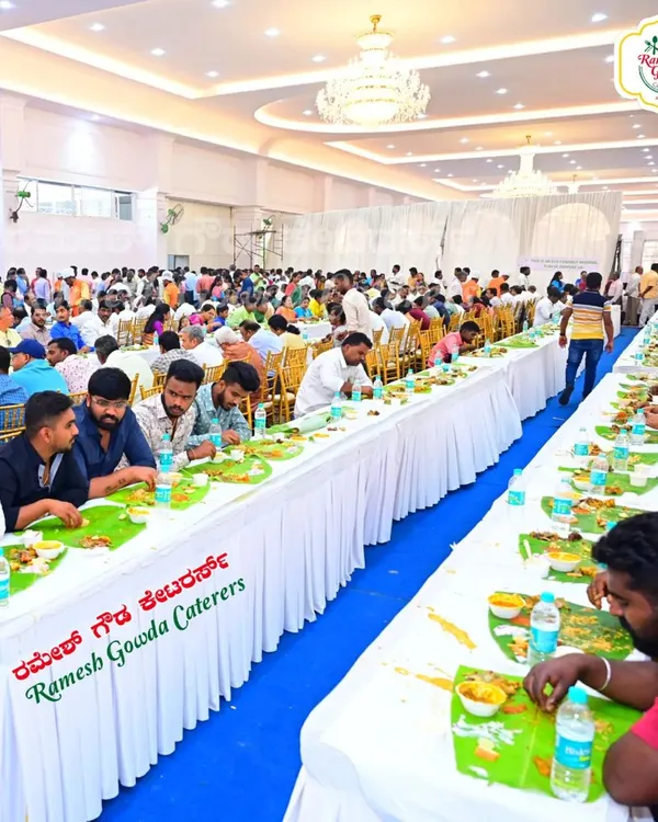 A packed convention hall with guests enjoying our traditional banana leaf meal. We are equipped to handle catering for large wedding receptions with flawless execution.