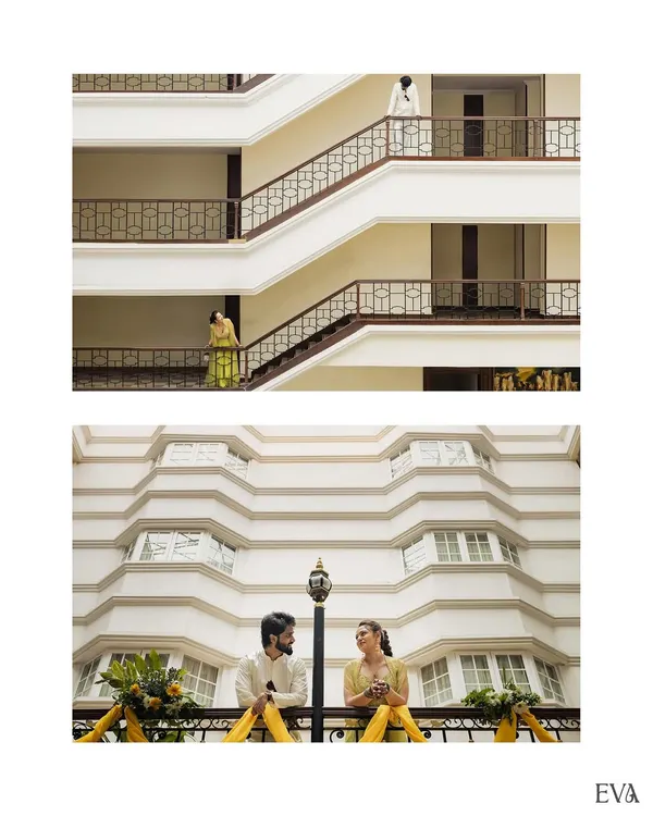 A creative architectural shot of the couple during their Mehendi day, using the building's lines to frame them beautifully.