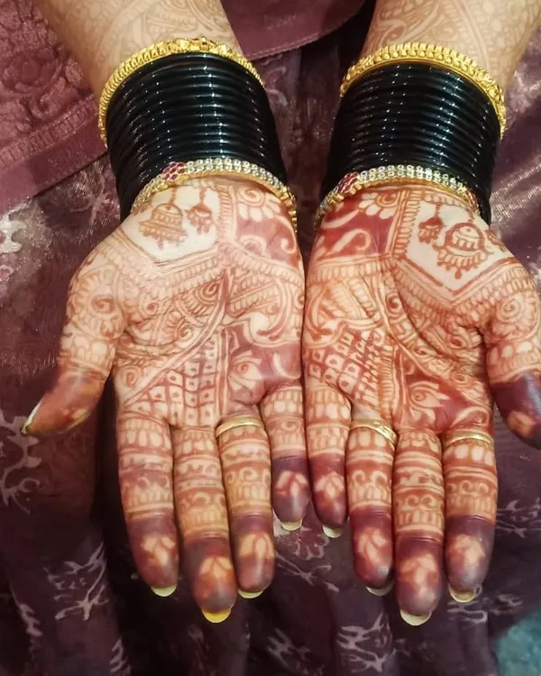 This is the beautiful, deep reddish-brown stain that develops a day or two after the henna paste is removed. This is the "pakka" bridal color.