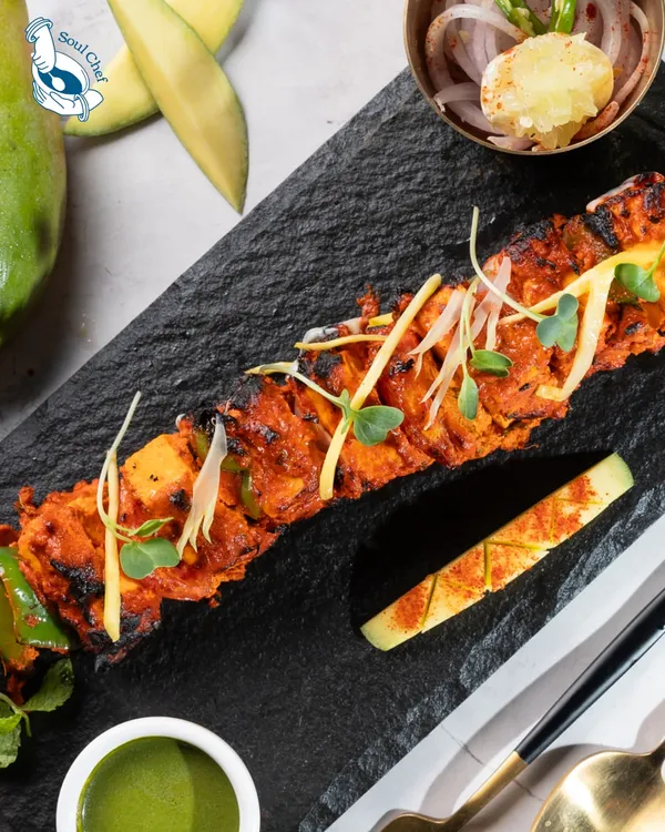 Our Mango Paneer Tikka is a signature creation, where classic tandoori paneer is elevated with the sweetness of mango for a unique flavor profile.