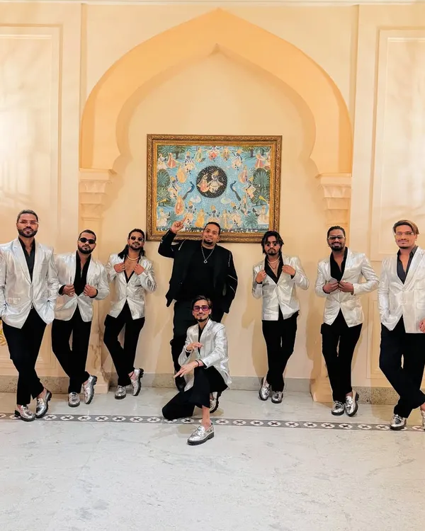 Suited up and ready for the sangeet night. Our team in silver jackets, bringing the style and the beats.