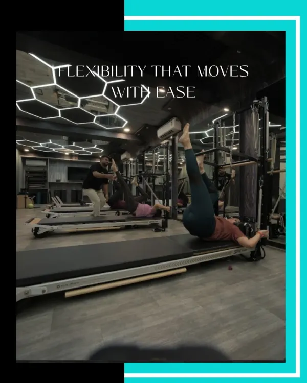 Flexibility that moves with ease. This client is performing a leg stretch on the Reformer, a move that improves hamstring flexibility and requires core control to stabilize the body.