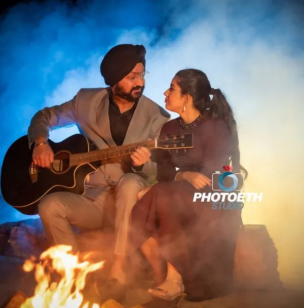 This is the kind of magic we can create for your pre-wedding shoot. We set up an intimate campfire scene at night, using the warm glow of the fire and colored smoke to create a truly romantic and cinematic atmosphere. It’s perfect for couples who want something unique and memorable.