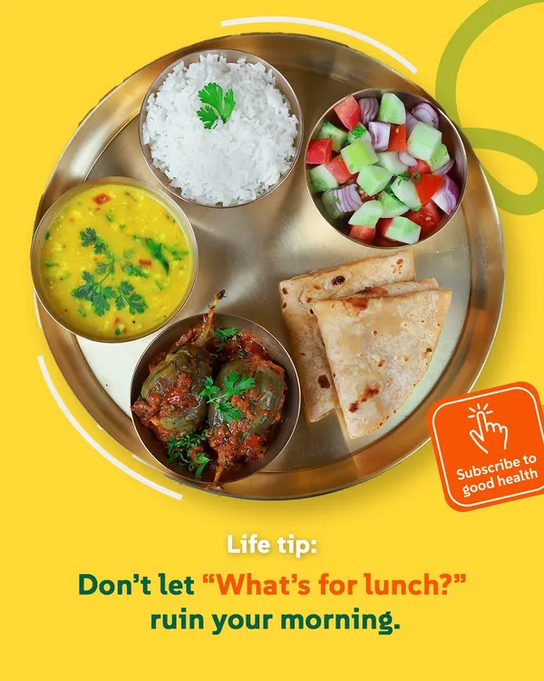 Life tip: Don't let "What's for lunch?" ruin your morning. A balanced thali with Bharwa Baingan, dal, rice, roti, and salad is the perfect answer to your midday hunger.