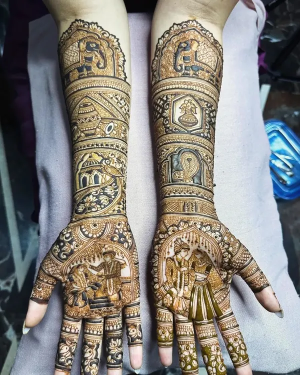 We can bring your entire wedding story to life through intricate figures and scenes. This design features the bride and groom, the doli ceremony, and elephants, creating a narrative henna masterpiece that is deeply personal and unique.