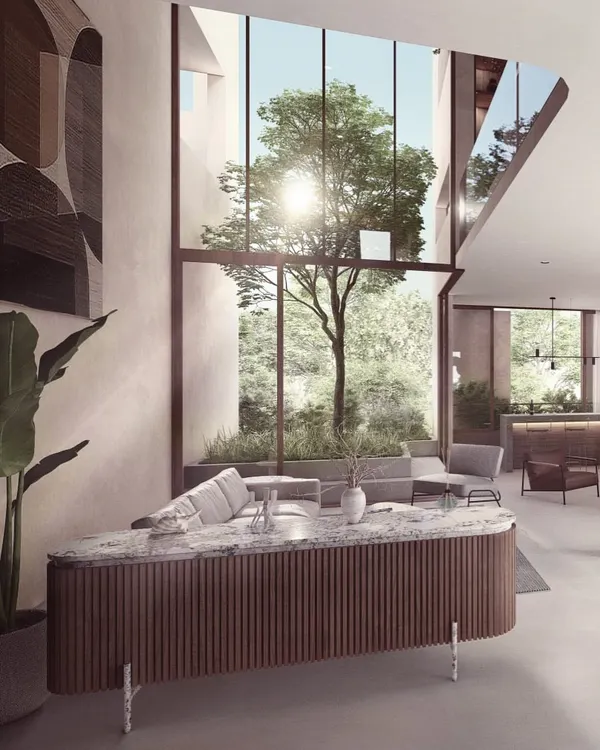 The kitchen in our Moira Homes project is designed as a social hub, with a large island that doubles as a breakfast bar. The open-plan layout connects it seamlessly to the living and dining areas, fostering interaction and flow.