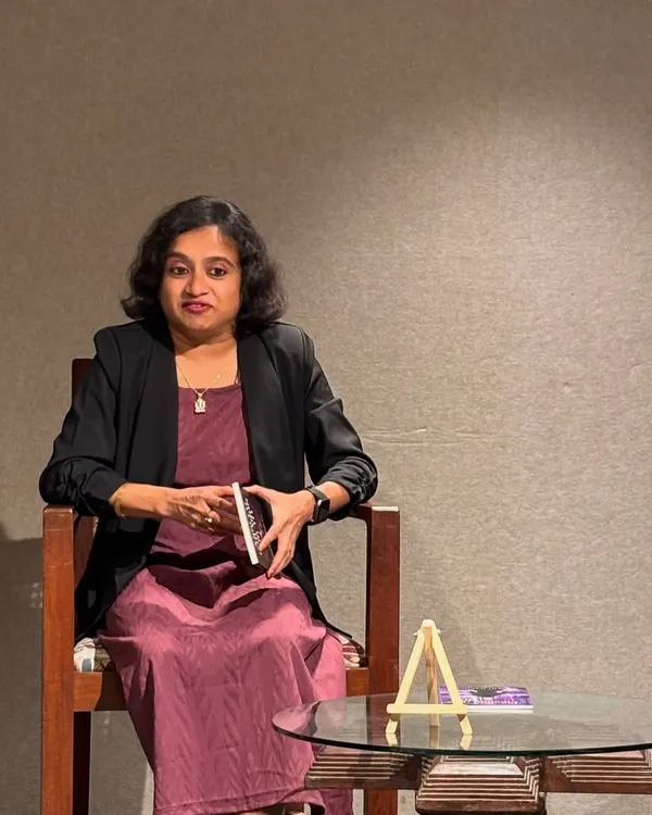 A glimpse into the weekend at our space. An author or speaker holds a book, ready to share her thoughts with an engaged audience.