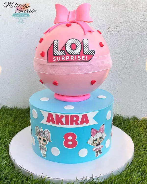 This was such a fun and crazy cake to create! It's a two-in-one surprise, featuring a custom LOL Surprise themed cake on the bottom and a giant, smashable pinata cake on top. It’s the perfect centerpiece for a truly memorable birthday party.