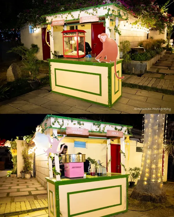 Fun is a key ingredient for a memorable event. We set up these charming, rustic stalls for popcorn and cotton candy, complete with whimsical monkey cutouts, adding a playful and interactive element that delighted guests of all ages.