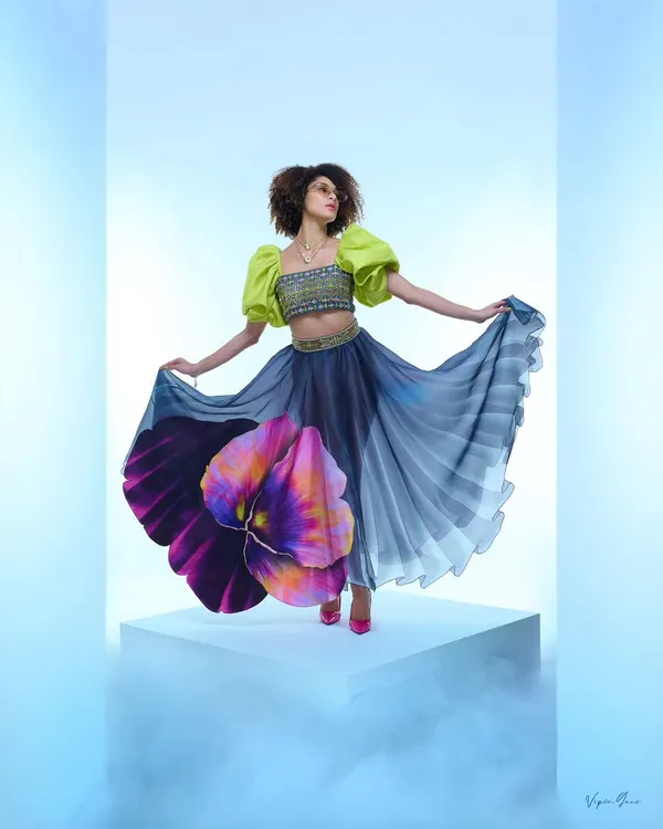 This shot from a designer campaign captures the energy and artistry I bring to fashion photography. The focus is on creating a dynamic mood that makes the garment feel alive, using dramatic posing and controlled studio lighting to highlight the flow and unique design of the skirt.