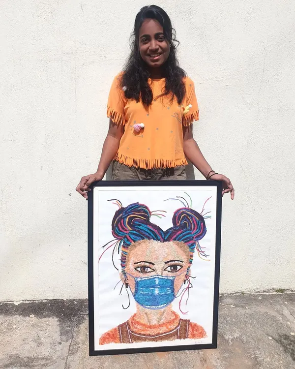 Here I am with my finished A1 size thread art portrait. You can see the unique texture and vibrant colours that make this technique so special.