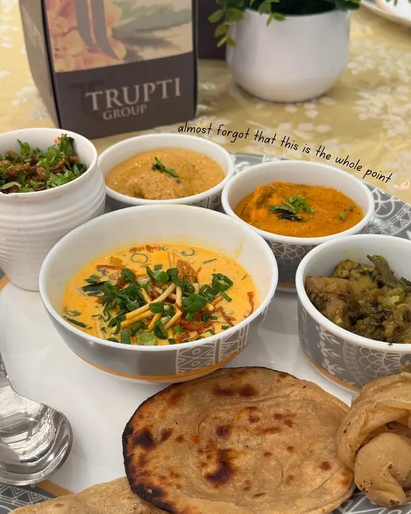 This is the heart of a Trupti wedding feast. A traditional Indian thali with a variety of subzis, dal, and hot roti, served with the elegance that defines our brand.