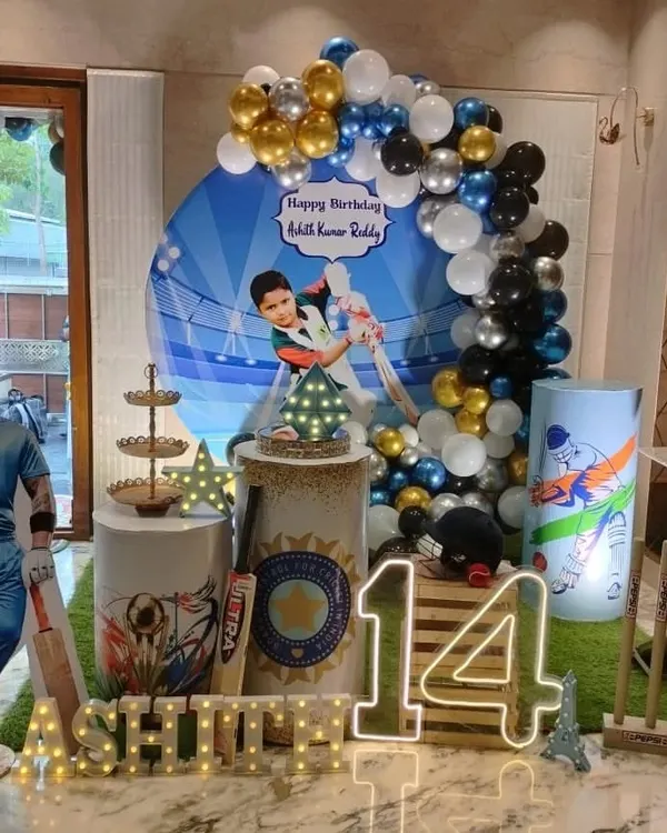 A cricket-themed birthday party for a 14-year-old, featuring a life-size cutout of a famous cricketer and a personalized backdrop.