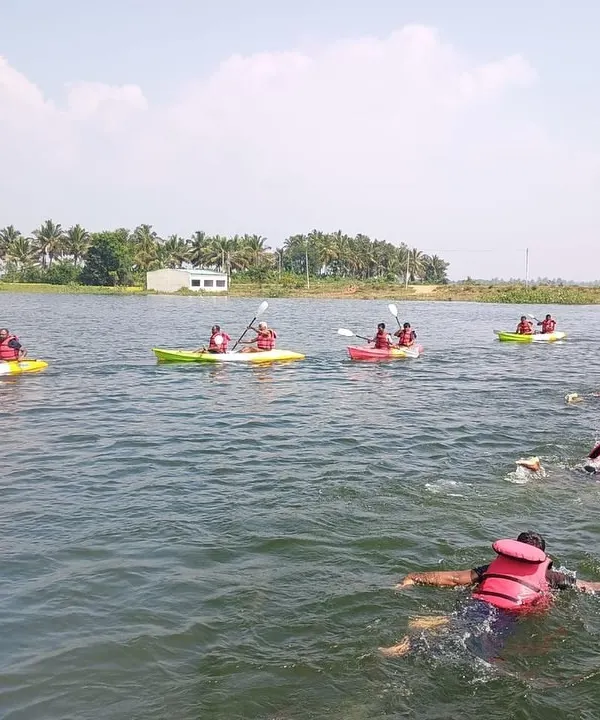 Participants enjoy a swim and kayak session in the calm waters of Ambigarahalli, a perfect location for our basic aqua sports courses.