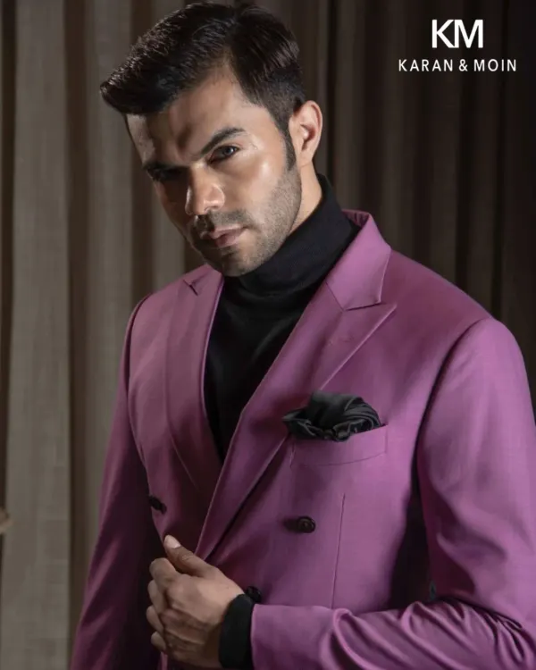 Luxury, tailored with intent. This double-breasted magenta suit paired with a black turtleneck is for those who understand that distinction doesn’t need to shout. This is Minimal Authority, where elegance is engineered.