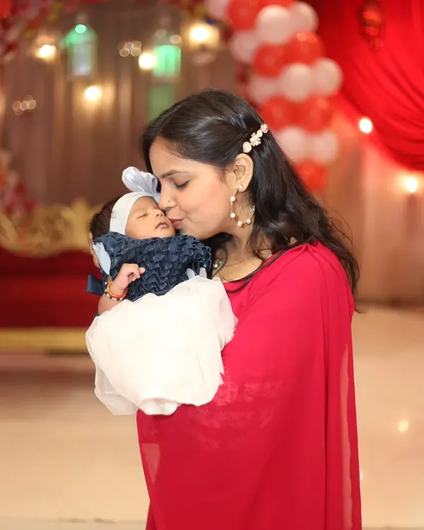 A mother's gentle kiss for her sleeping baby. These are the moments of pure love that I aim to capture in every family photoshoot.