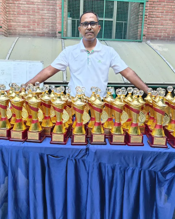 Trophies lined up and ready for the deserving champions at the GGems Inter-school Squash Tournament. Recognizing the hard work of every participant is a cornerstone of our events.