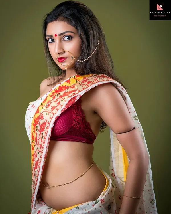 This is the essence of modern desi swag. A powerful portrait combining traditional elements like the saree and nose ring with a bold, unapologetic gaze. It's about capturing the goddess within, liberated and fierce.