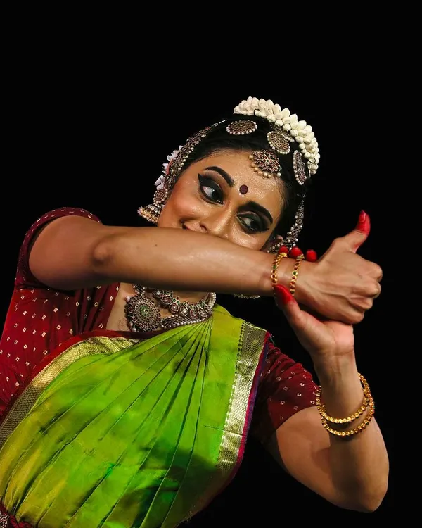A close-up capturing the playful mischief and storytelling of abhinaya, from a performance at the Krishna Gana Sabha Pongal Dance Festival.
