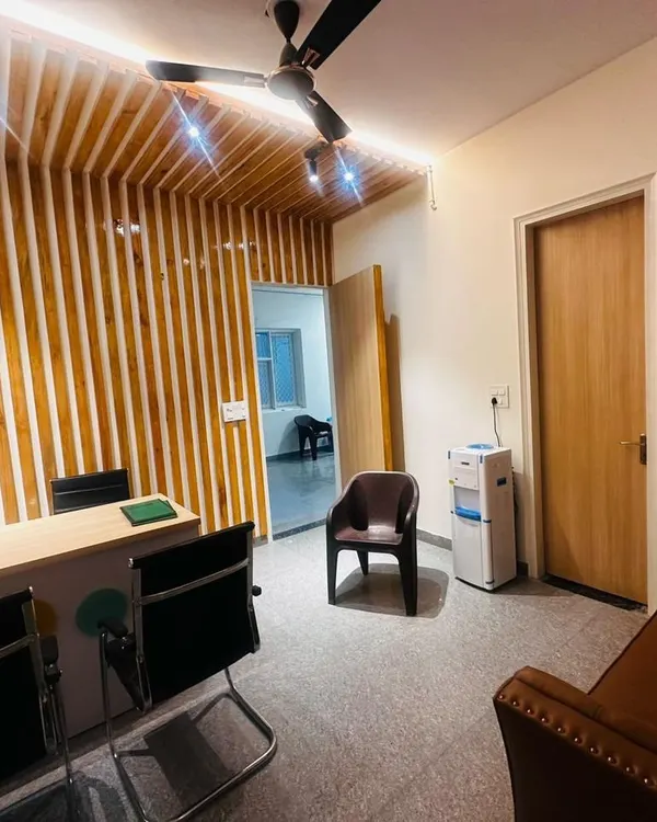 This reception area for the Eurokid project shows how I blend modern aesthetics with practical function. The backlit wooden slat wall creates a warm, professional first impression, which is crucial for any business.