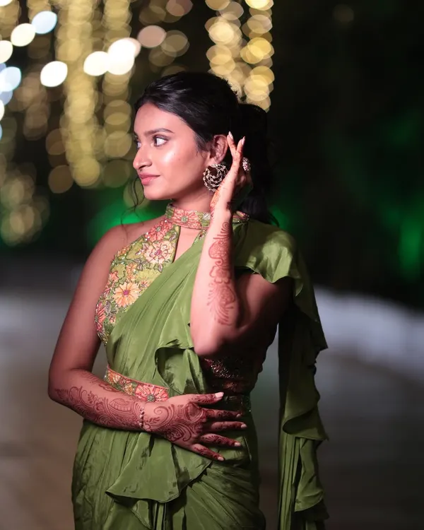 A beautiful look for the sister of the bride. She is wearing a modern Indo-Western saree, so we opted for minimal makeup with a dewy finish and a stylish ponytail.