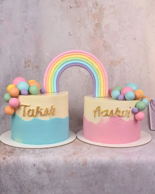 For a joint birthday celebration for twins, I made two separate cakes connected by a single rainbow topper. A sweet way to give each child their own cake while celebrating together.