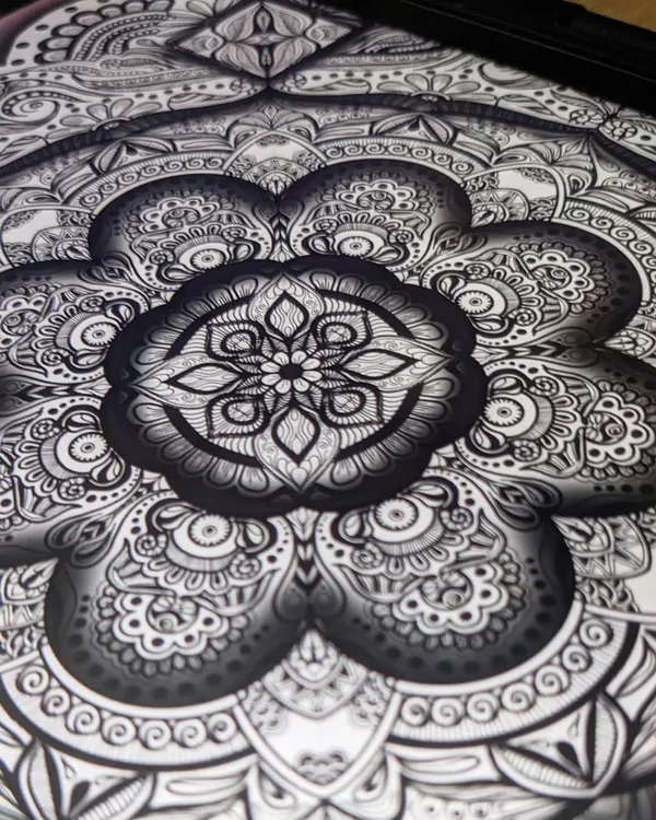 I have loved drawing patterns since I was young. This close-up of a mandala shows the intricate details and shading that bring me so much joy to create.