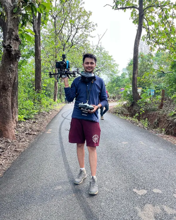 On location holding my custom-built cinelifter drone, which is designed to carry heavier cinema cameras like the Blackmagic Pocket series for high-quality commercial shoots.