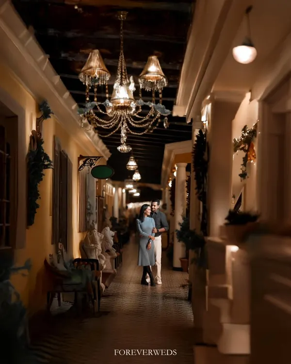 The right location can transport you. This elegant, warmly lit corridor gave Atul and Rachita's pre-wedding shoot a timeless, almost European feel. I love using architectural details and ambient light to create a mood of sophisticated romance.