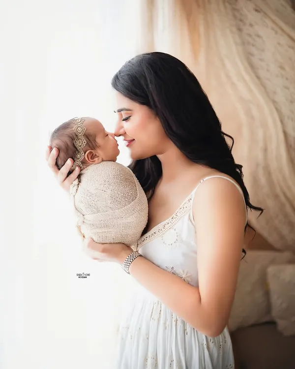 The beautiful connection between a mamma and her newborn is a moment to be cherished forever. This tender nose-to-nose portrait in soft, natural light captures that incredible bond.