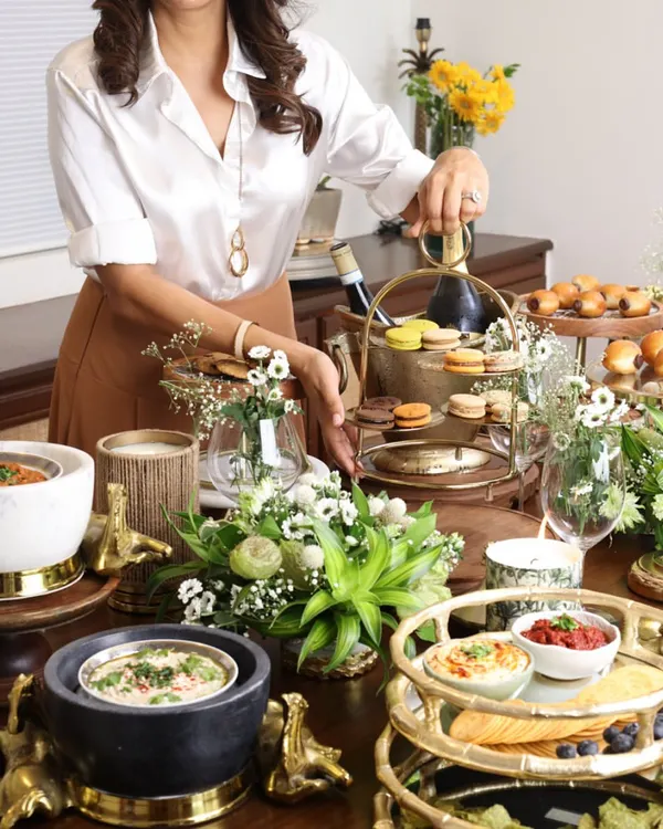 We believe hosting is an art form, a way to create moments that feel both special and effortlessly elegant. This tablescape, rich with our curated trays, serveware, and candles, is a testament to that philosophy, turning any gathering into a memorable experience.