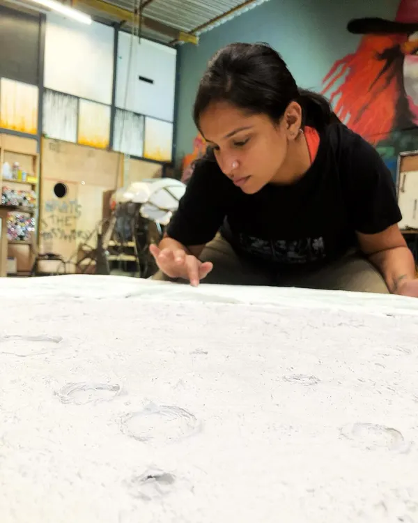Here I am, completely absorbed in creating the textured surface of my moon sculpture. This work-in-progress shot captures the focus and hands-on detail that goes into every piece. I'm clearly over the moon!