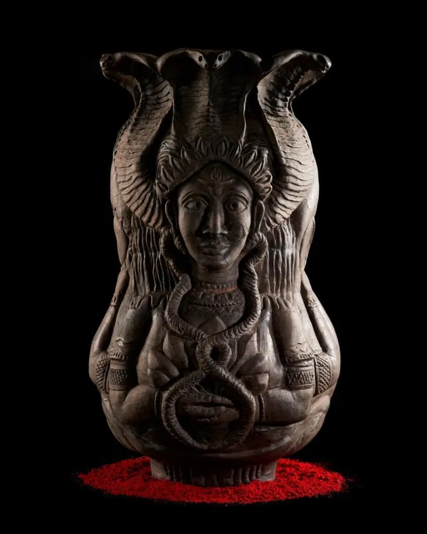 This piece, 'Cosmic Temple', explores the body as a gateway to the expanse within. It is hand-built from paperclay terracotta, intricately carved to represent the flow of energy, and stands as a testament to months of patient work.