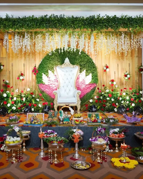 This is the kind of grand display I can create for your special day. This Sreemantham (baby shower) setup features a full stage arrangement with dozens of my decorative platters, stands, and a beautiful floral backdrop, ensuring a memorable event.