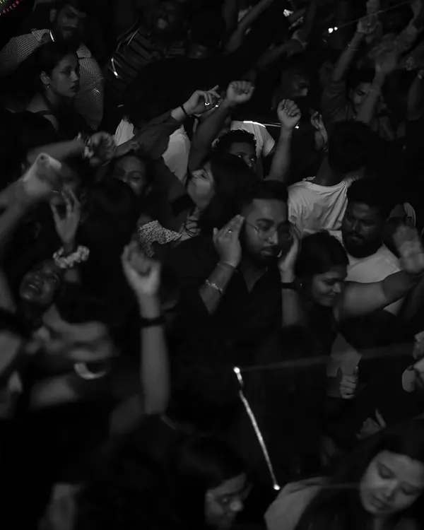 A black and white shot capturing the pure joy of the crowd, lost in the music. This is the kind of moment I strive to create every night.
