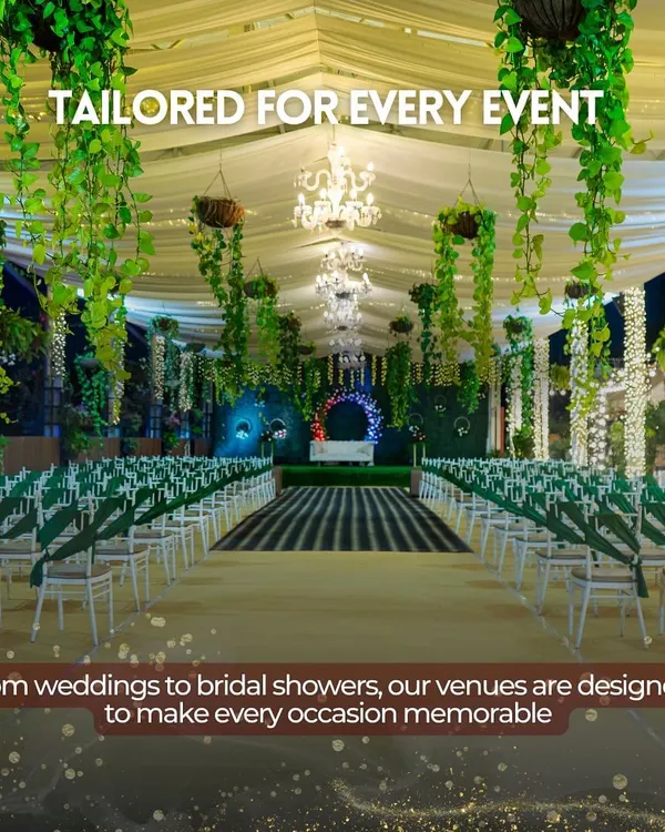 A breathtaking view down the aisle of our Sky Terrace, set for a grand wedding. The elegant green and white theme, with hanging greenery and chandeliers, shows how we transform our 13,000 sq. ft. space into a fairytale setting.