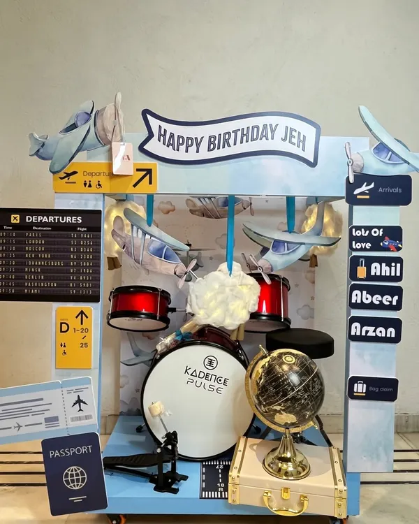 I believe a gift should be an entire world of its own. This bespoke travel-themed birthday hamper, complete with a miniature drum kit, a globe, and personalized airport signage, was designed to capture a little boy's biggest dreams of adventure.