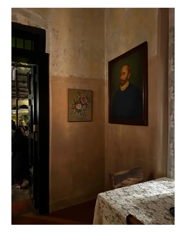It gives me immense happiness to see a space I designed, like The Lovefools restaurant, thriving with people celebrating and enjoying the vibe. This moody corner with vintage art captures the romantic, soulful atmosphere we created.