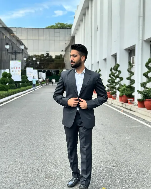 A professional portrait in a business suit. My approach to law is forward-looking, combining traditional legal principles with a modern, strategic mindset.