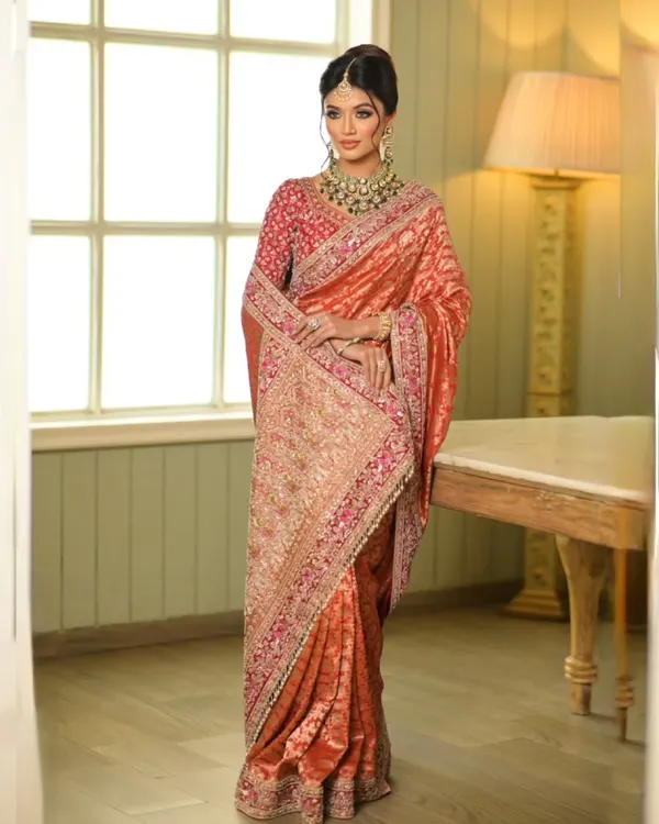 This Banarasi Kadwa handloom saree is a work of art. I draped it with a double dupatta to create a regal and layered look, perfect for a bride who wants to blend tradition with high fashion.